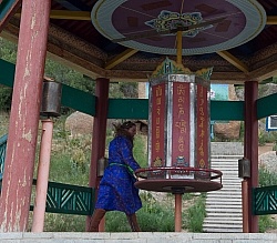 Shawn turning the wheel at the Buddhist Monastery