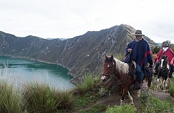 Gabriel and Rodrigo riding around  Crater Lake at Quilotoa volca