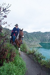 Gabriel a riding around  Crater Lake at Quilotoa volcano