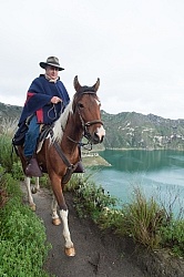 Gabriel riding around  Crater Lake at Quilotoa volcano