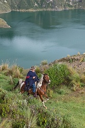 Gabriel riding at  Crater Lake at Quilotoa volcano
