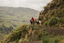 Rodrigo follows the trail on the mountain edge.