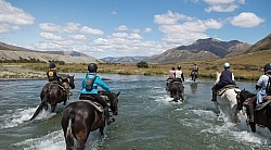 Riding through a  River in Ahuriri Conservation Area New Zealand , Wild Women Expeditions with Adventure Horse Trekking New Zealand 