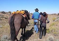 Shawn follows Mike wiht her Camera on the Ride To the Wild horses with Blue Sky Sage
