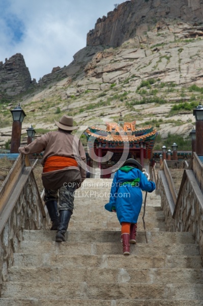 Baagii and Bugiin climb the Stairs to the Monastery