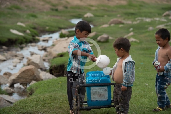 Kids Collecting Water from the River Mongolian Children Fetching Water